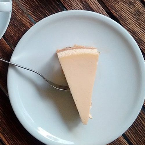 top view of low carb keto cheesecake on blue plate.