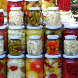 jars of pickled foods like okra, cauliflower, garlic, peppers, onions and more